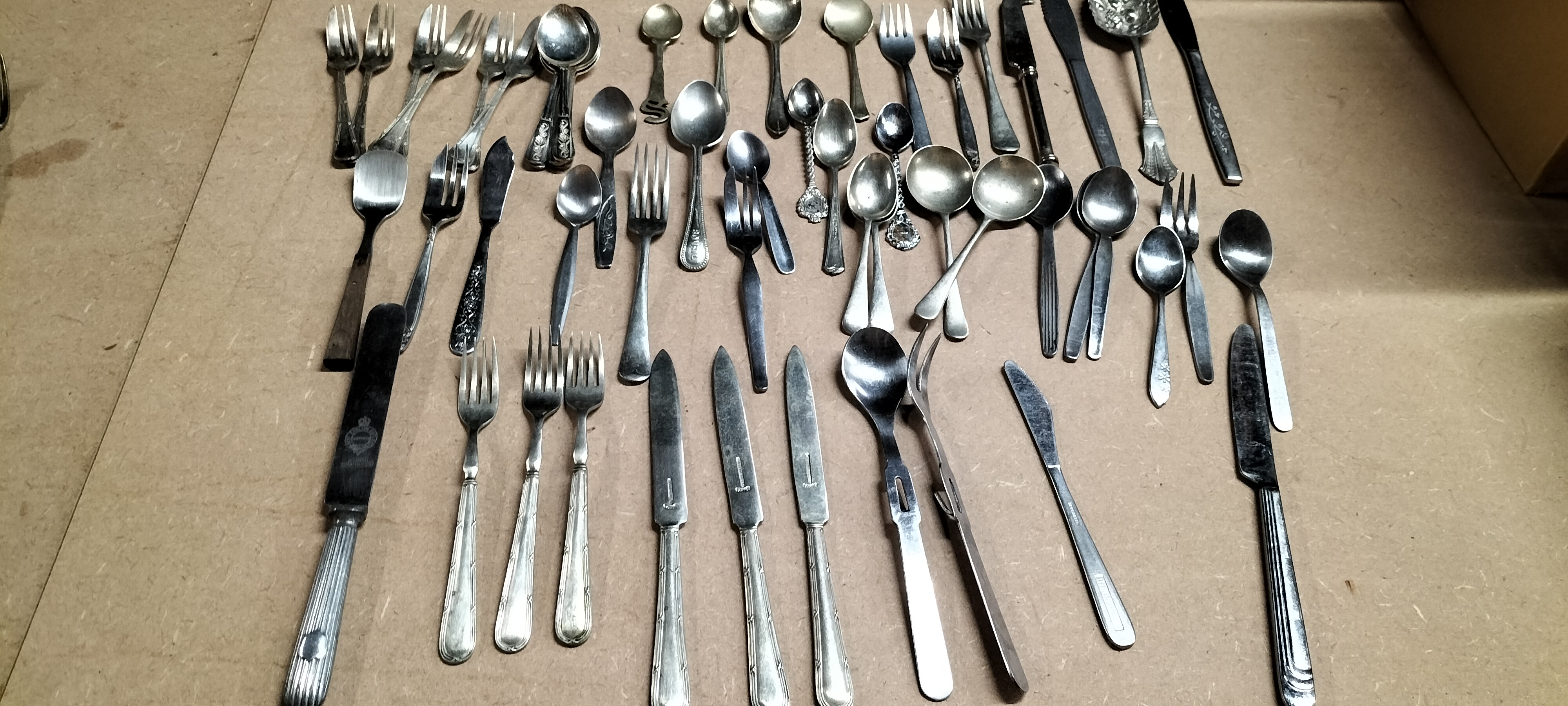 A Collection of 49 Pieces of Silver Toned and Stainless Steel Flatware