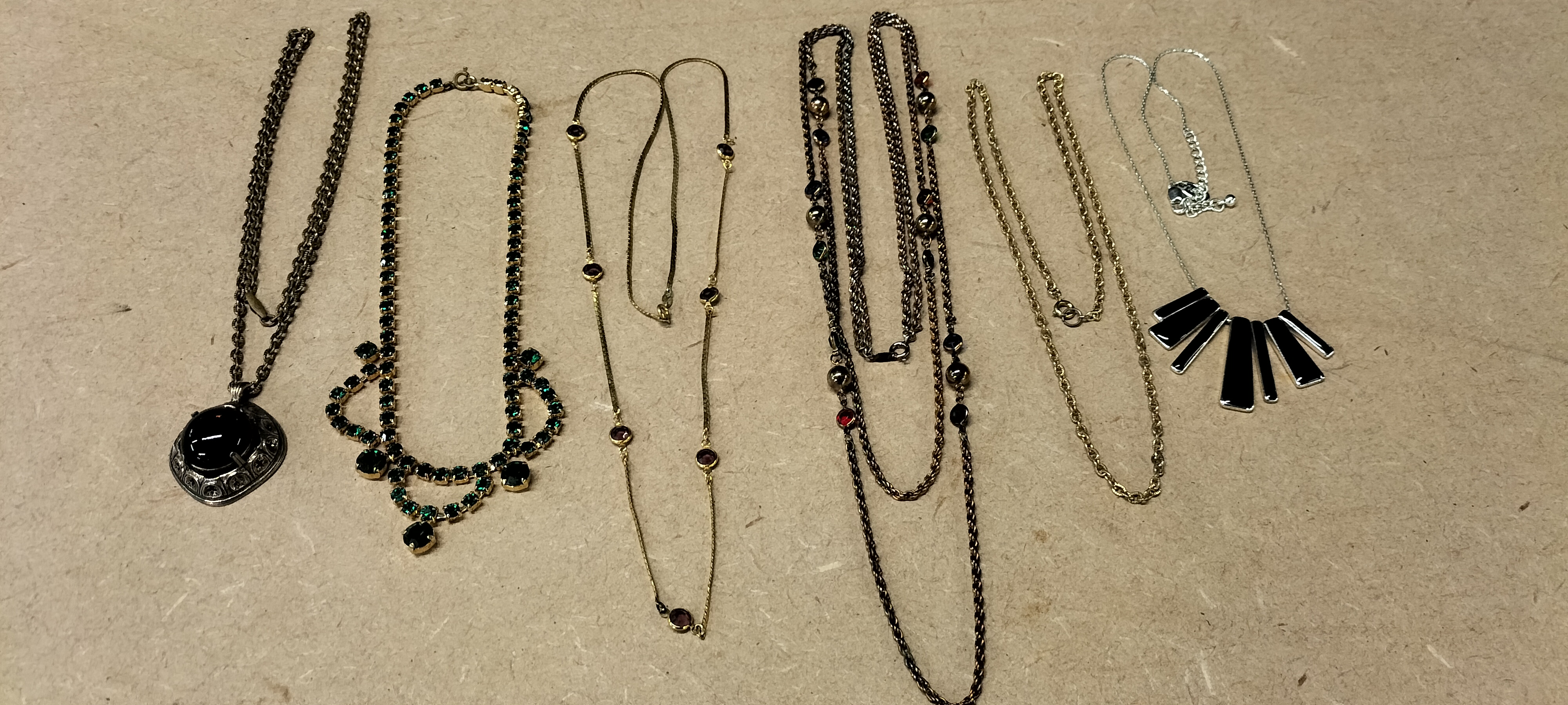A Collection of Assorted Base Metal and Glass Costume Necklaces
