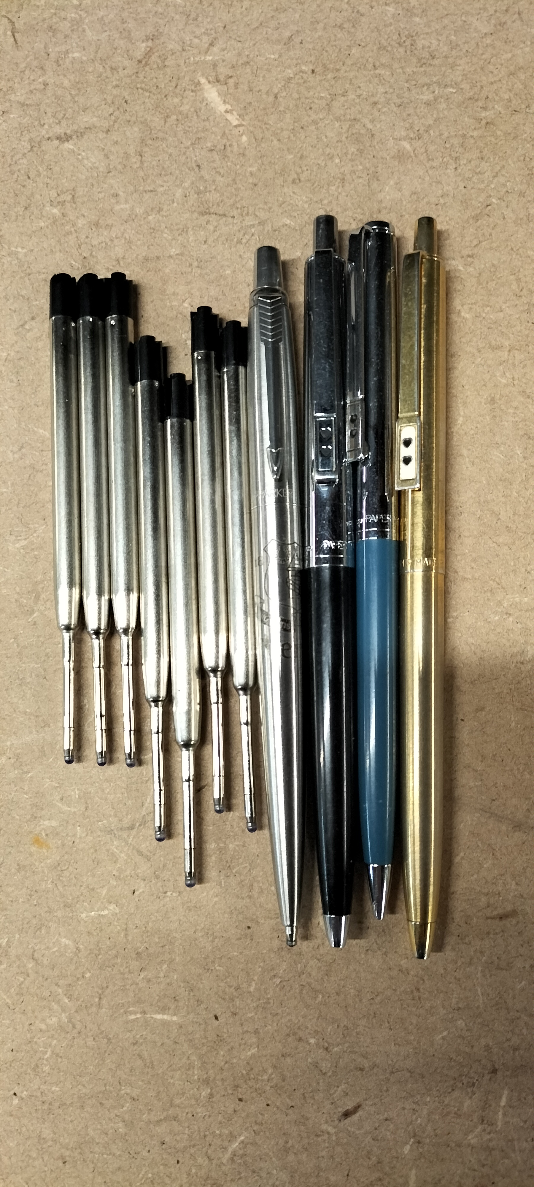 An Assortment of 4 Parker and Paper Mate Ballpoint Pens and 7 Refills