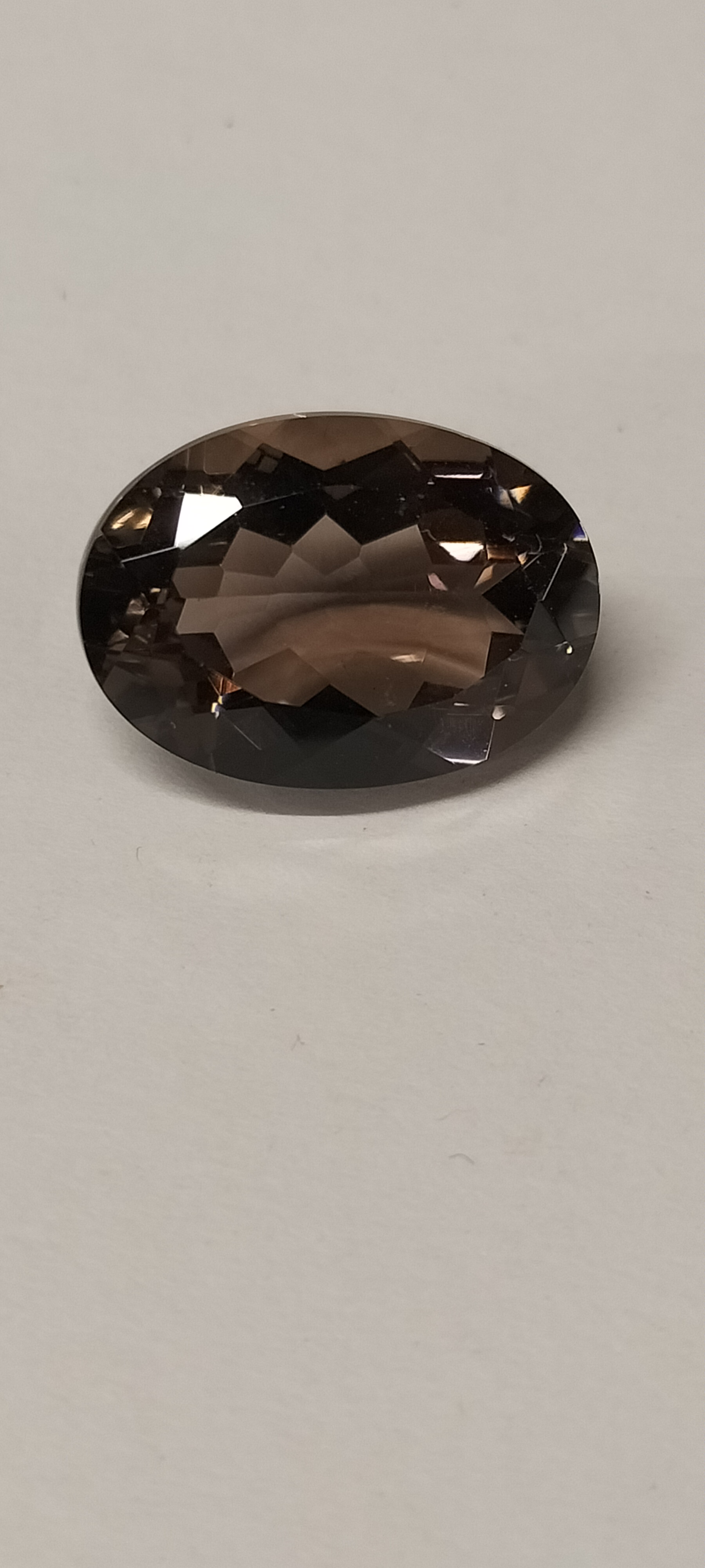 A Large Oval Faceted Chocolate Topaz Gemstone. 11.85 ct