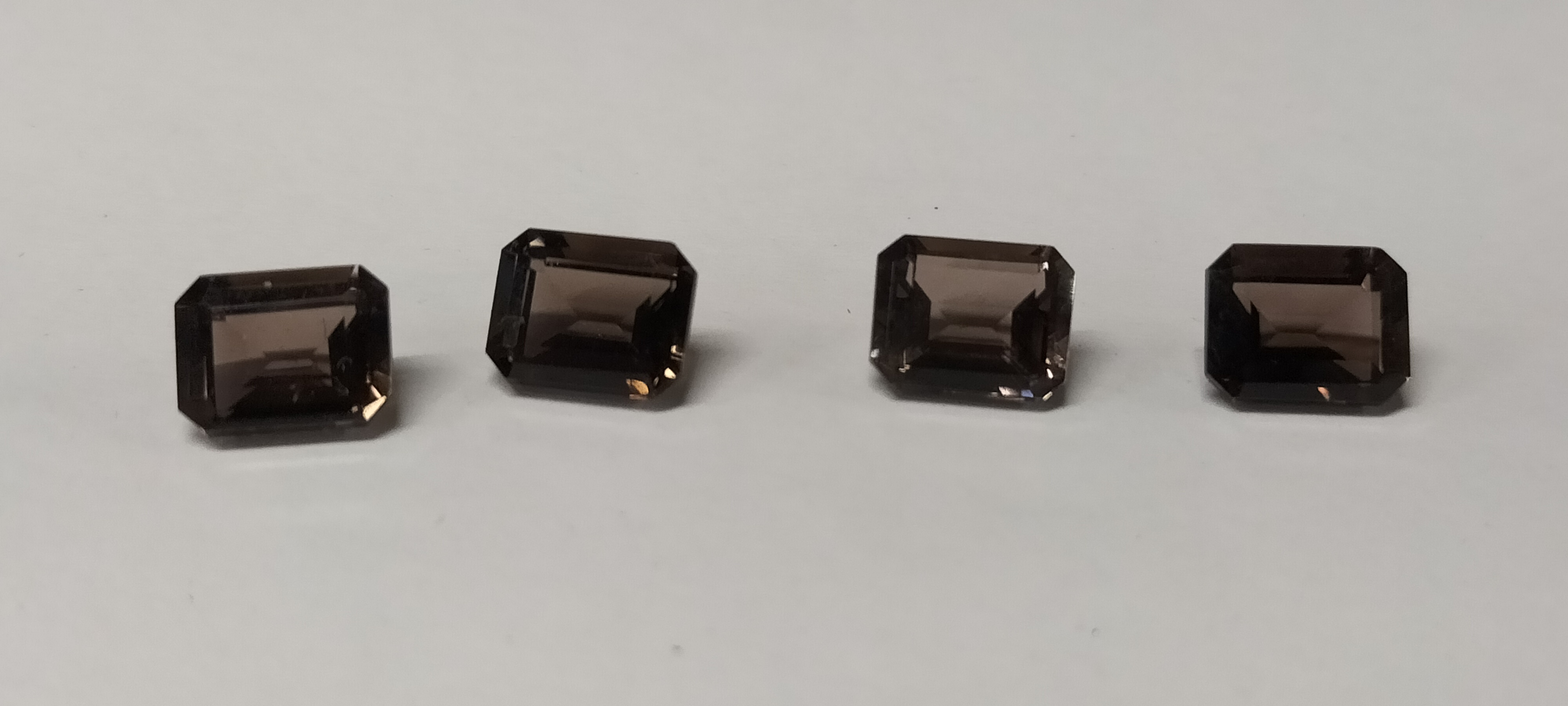 4 Loose Chocolate Topaz Emerald Cut Gemstones. 12.15ct