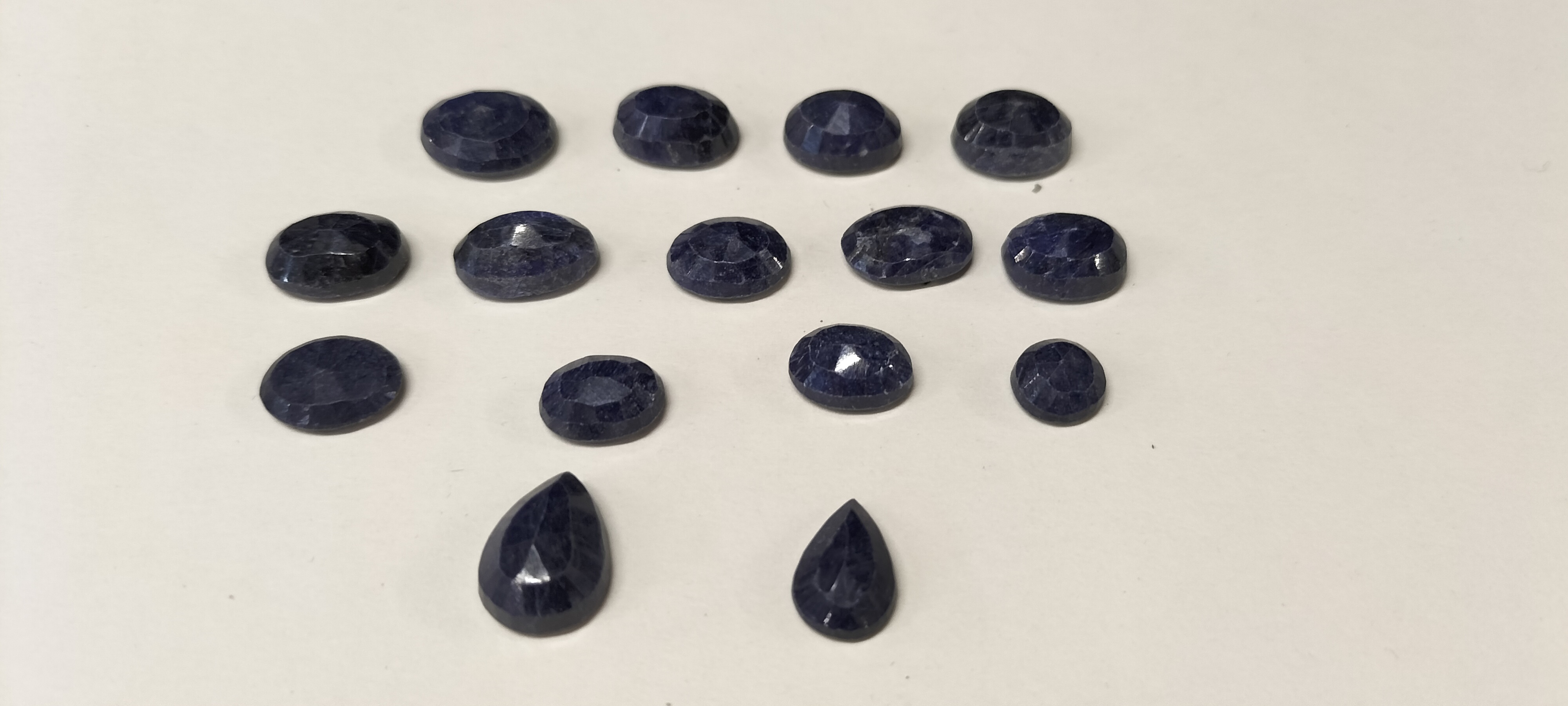 15 Lapis Lazuli  Faceted Loose Gemstones including 13 Oval and 2 Pear Cut Stones. 80.45ct