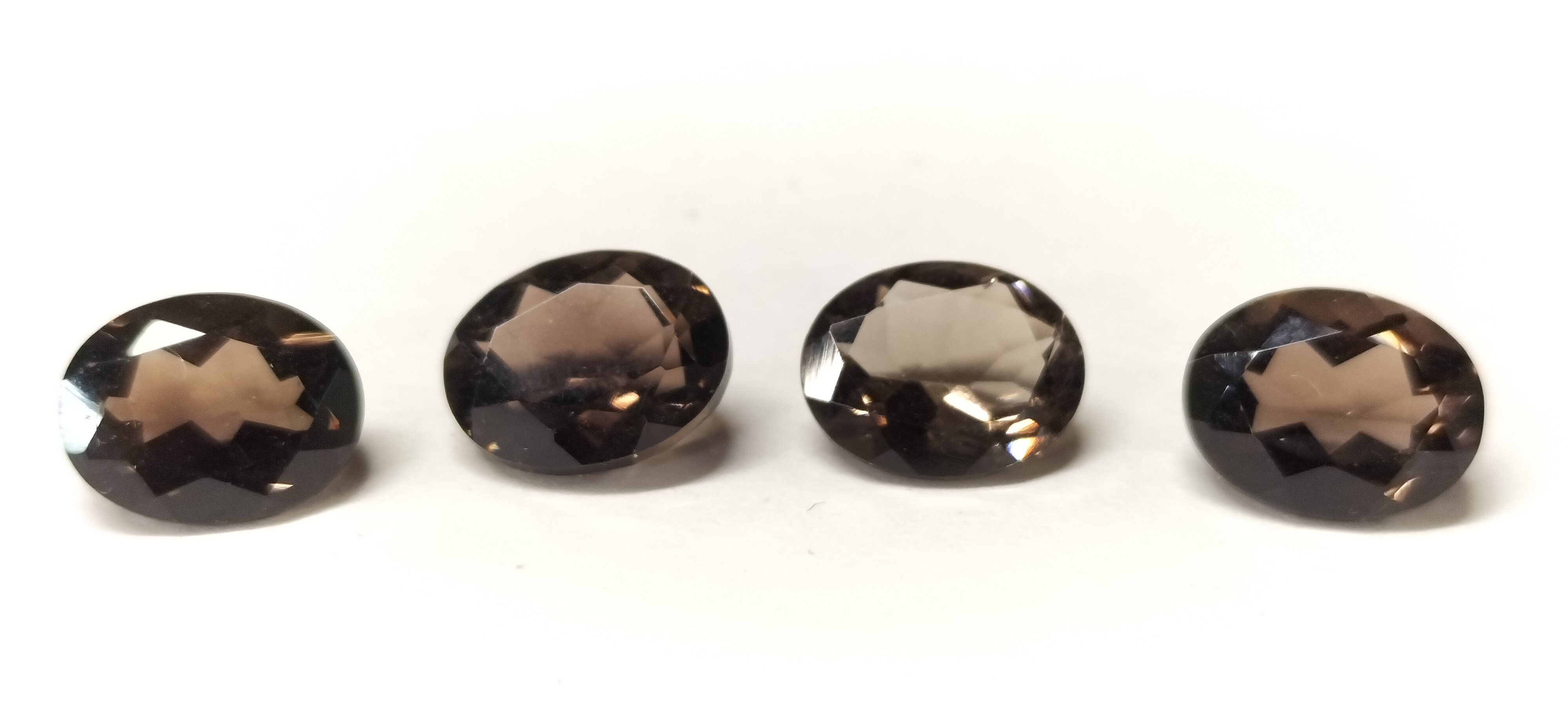 A Set of 4 Faceted Oval Cut Chocolate Topaz Loose Gemstones. 7.55ct