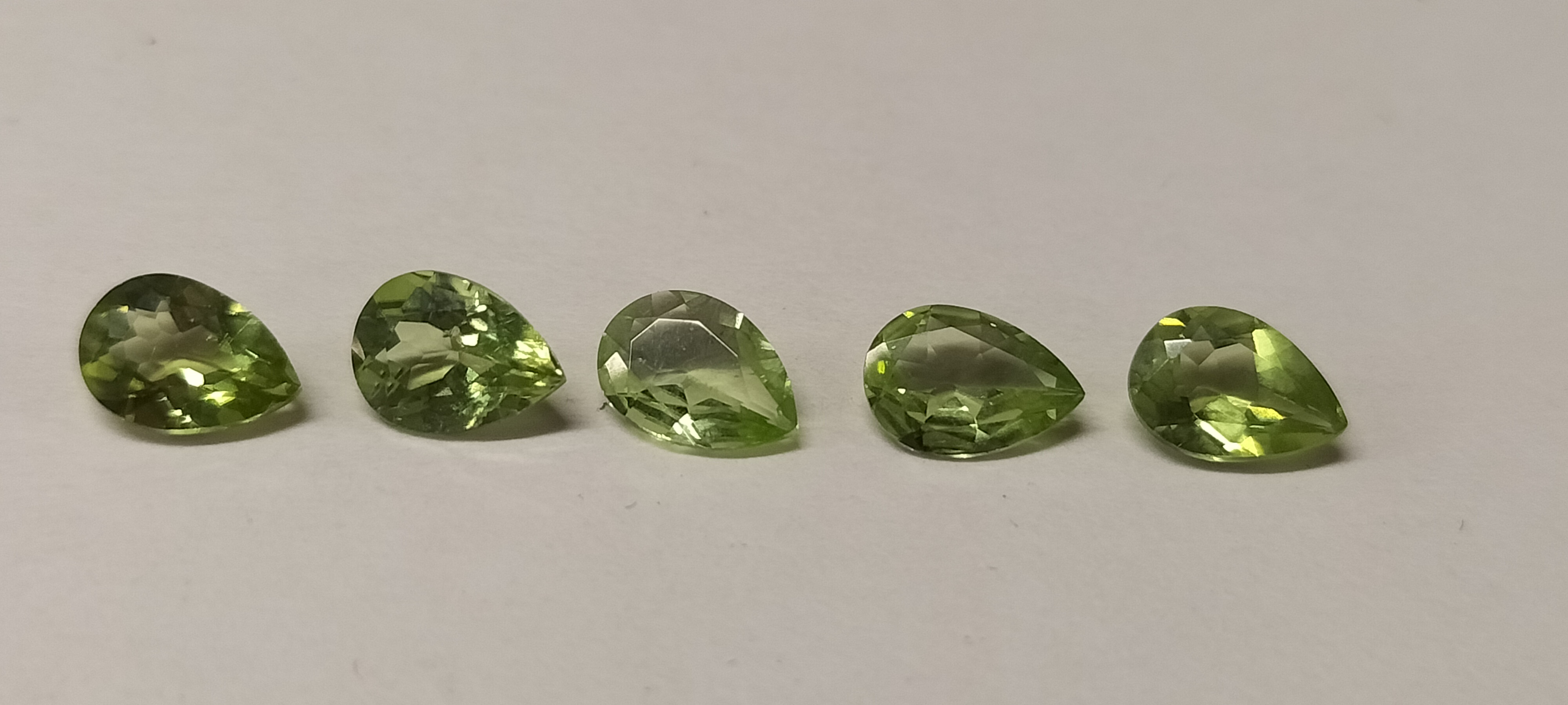 A Collection of 5 Peridot Pear Shaped Faceted Gemstones.3.00ct