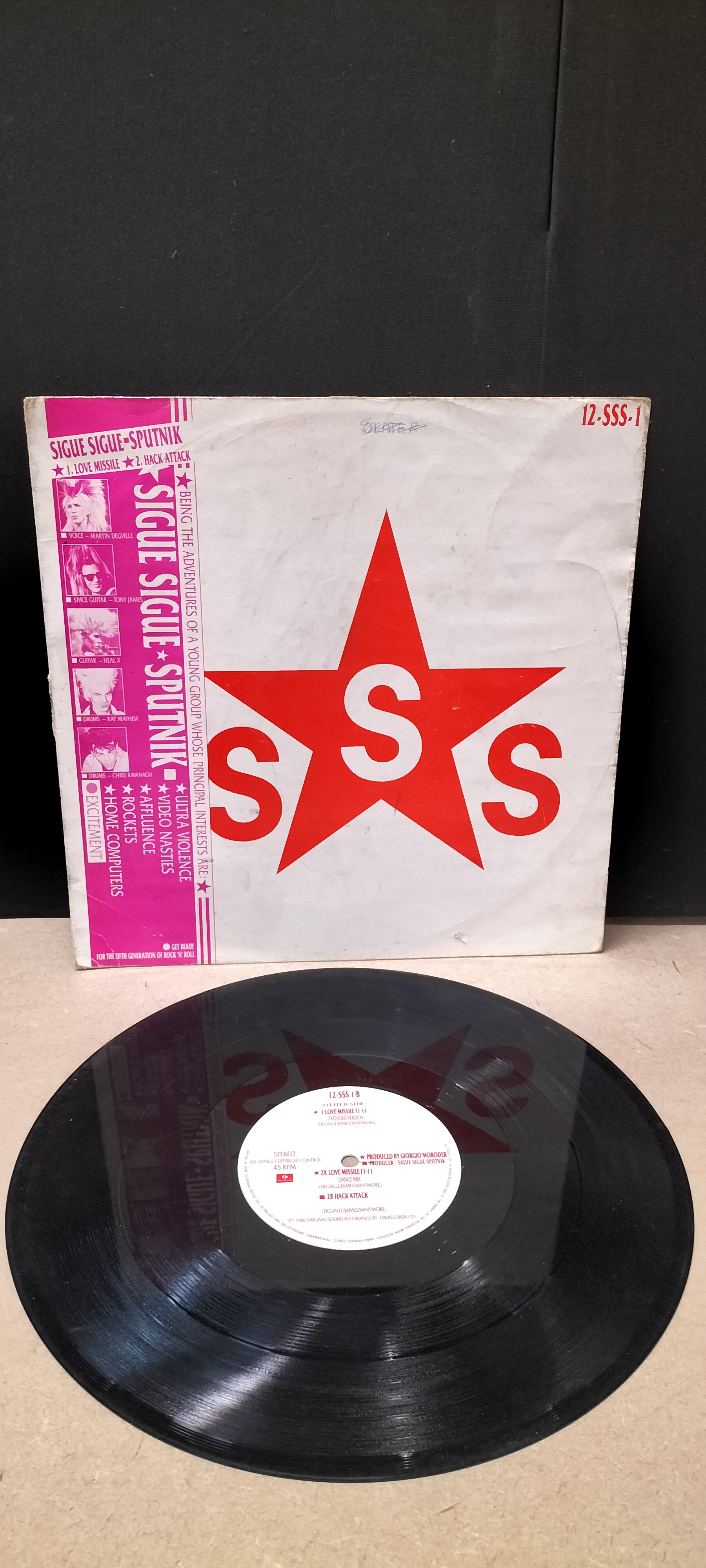 A Sigue Sigue Sputnik Love Missile F1-11 Parlophone 12-Inch Vinyl Single, 12-SSS 1. Has Damage to the Edge