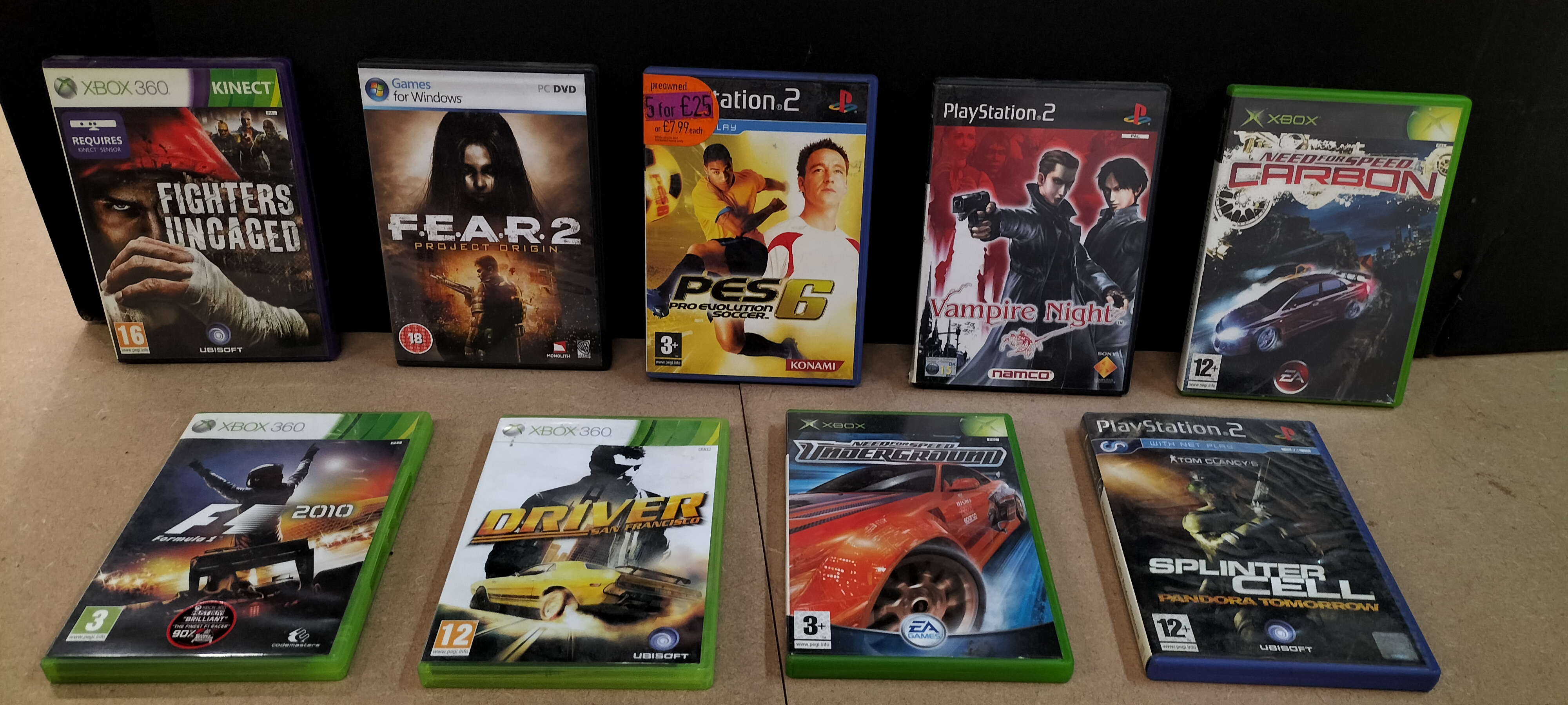 A Collection of 9 Assorted Empty Video Game Cases and Manuals for Xbox, PlayStation 2 and PC
