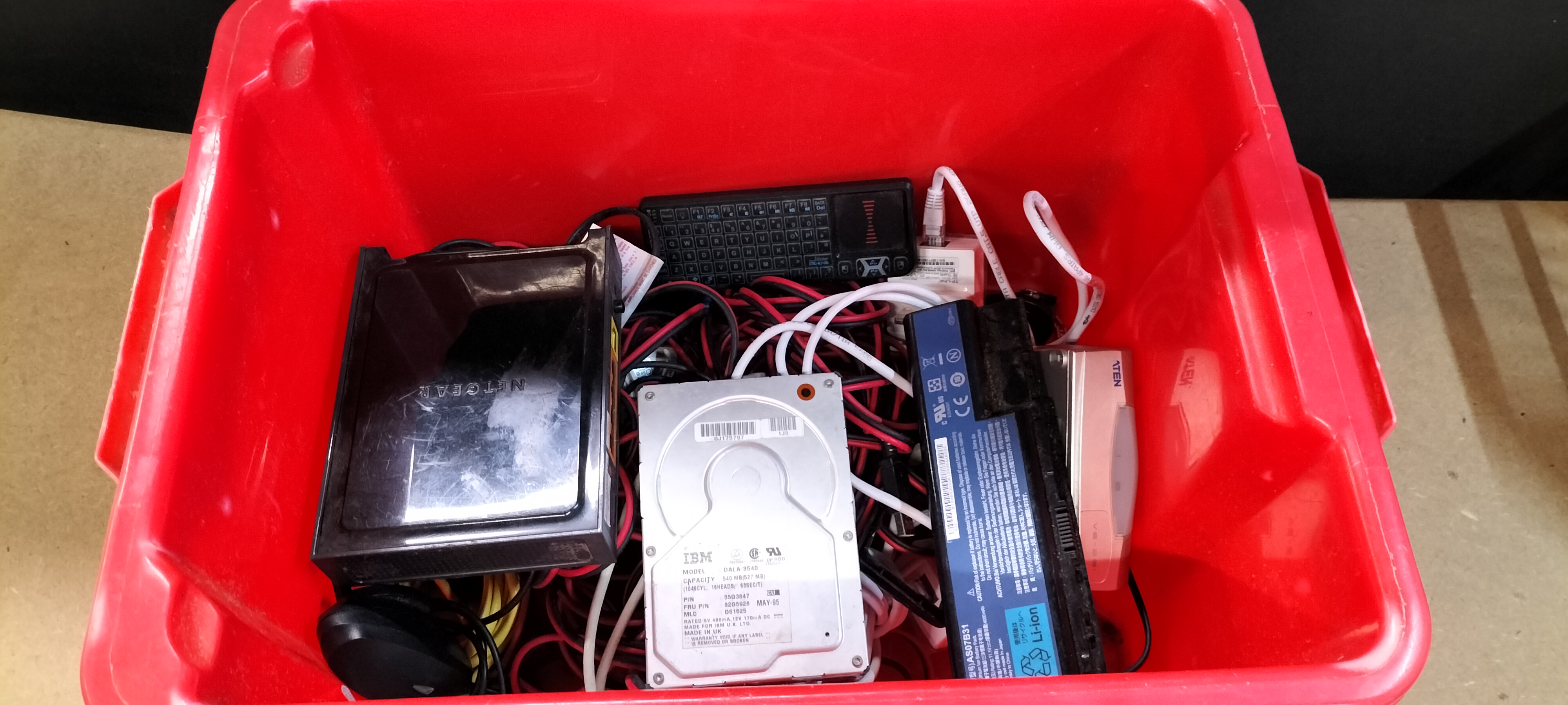 An Assortment of IBM DALA-3540, Netgear and ATEN Computer Components and Cables