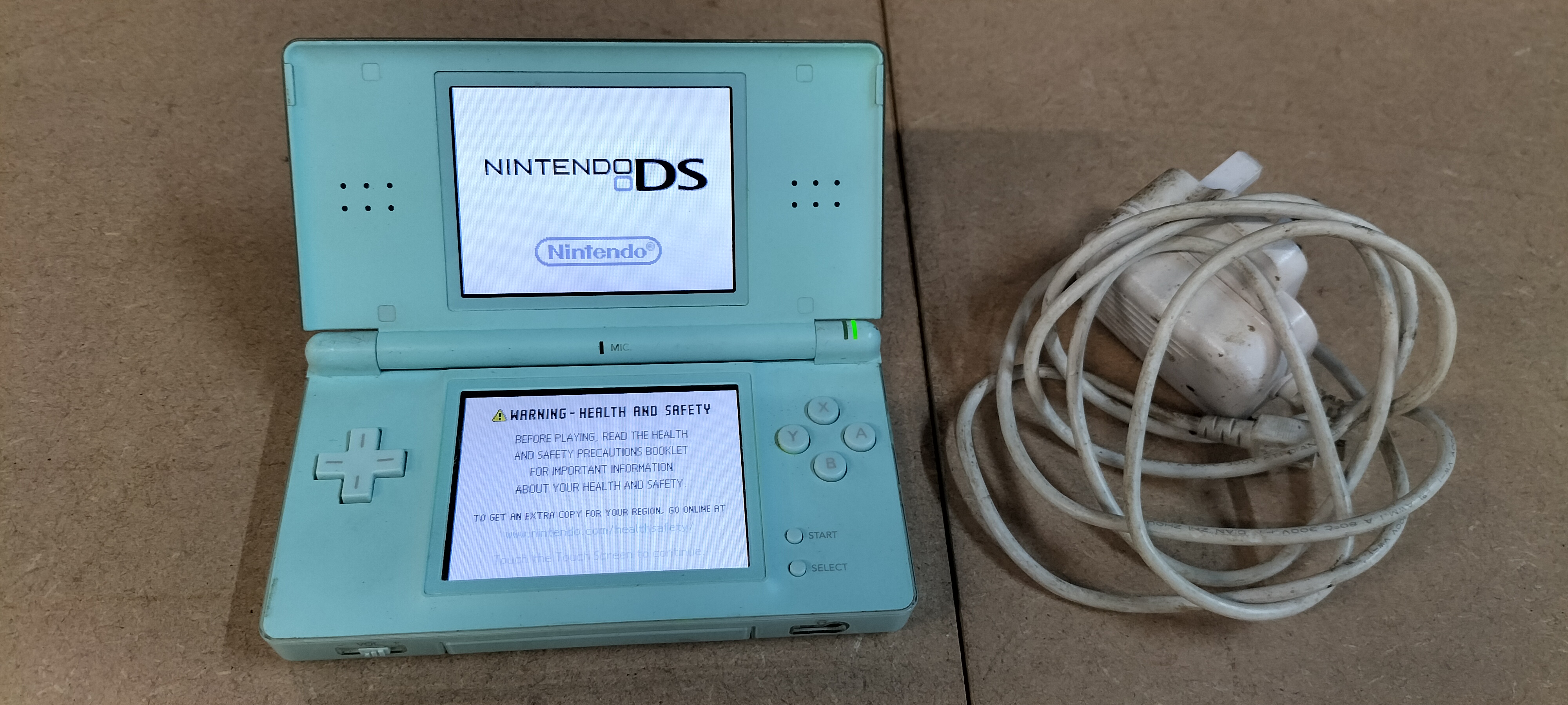 A Collection of 3 Plastic Nintendo DS Lite Items including Model USG-001 and Game