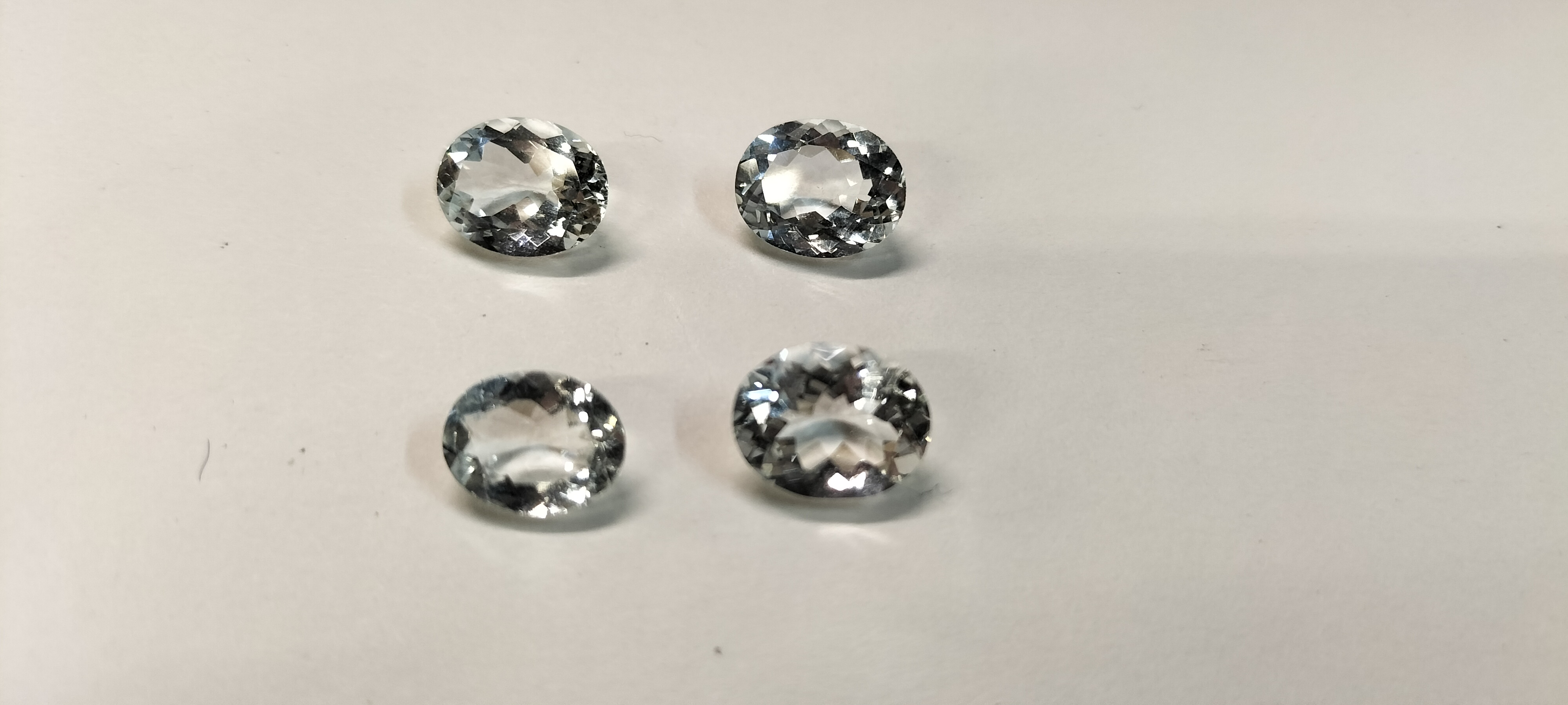 4 Aquamarine Faceted Oval Cut Pale Blue Gemstones. 7.95ct