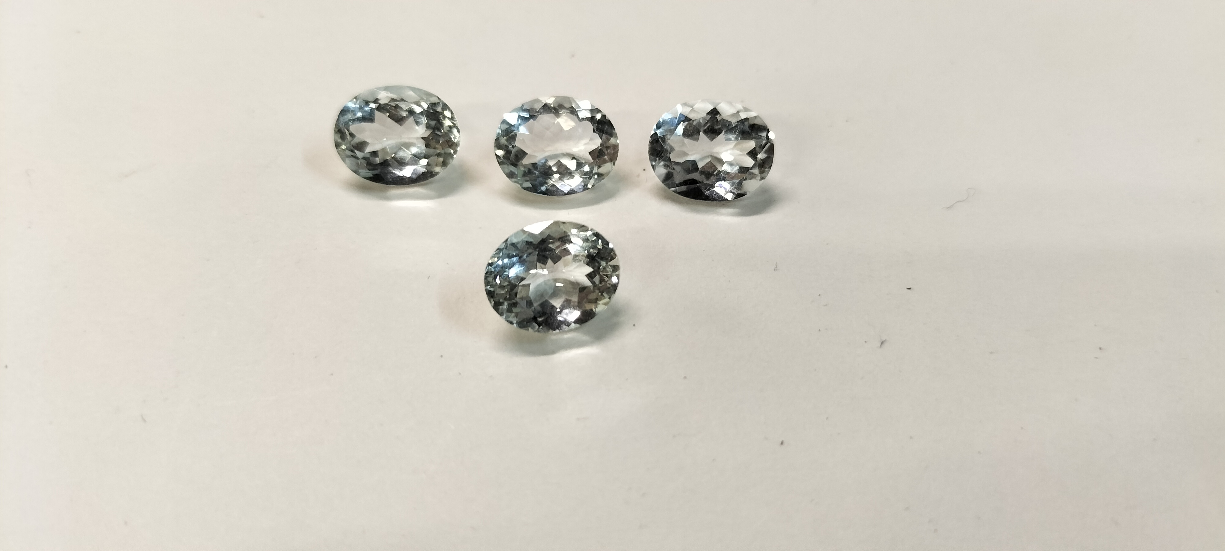 4 Aquamarine Oval Faceted Gemstones. 9.65 ct