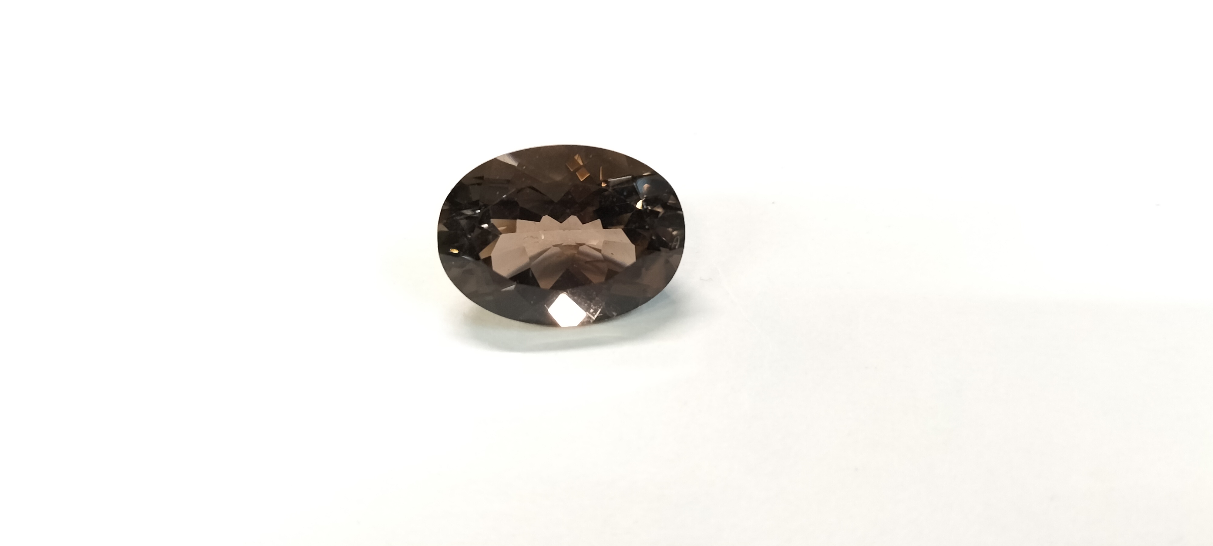 An 11.45ct Oval Faceted Loose Chocolate Topaz Gemstone
