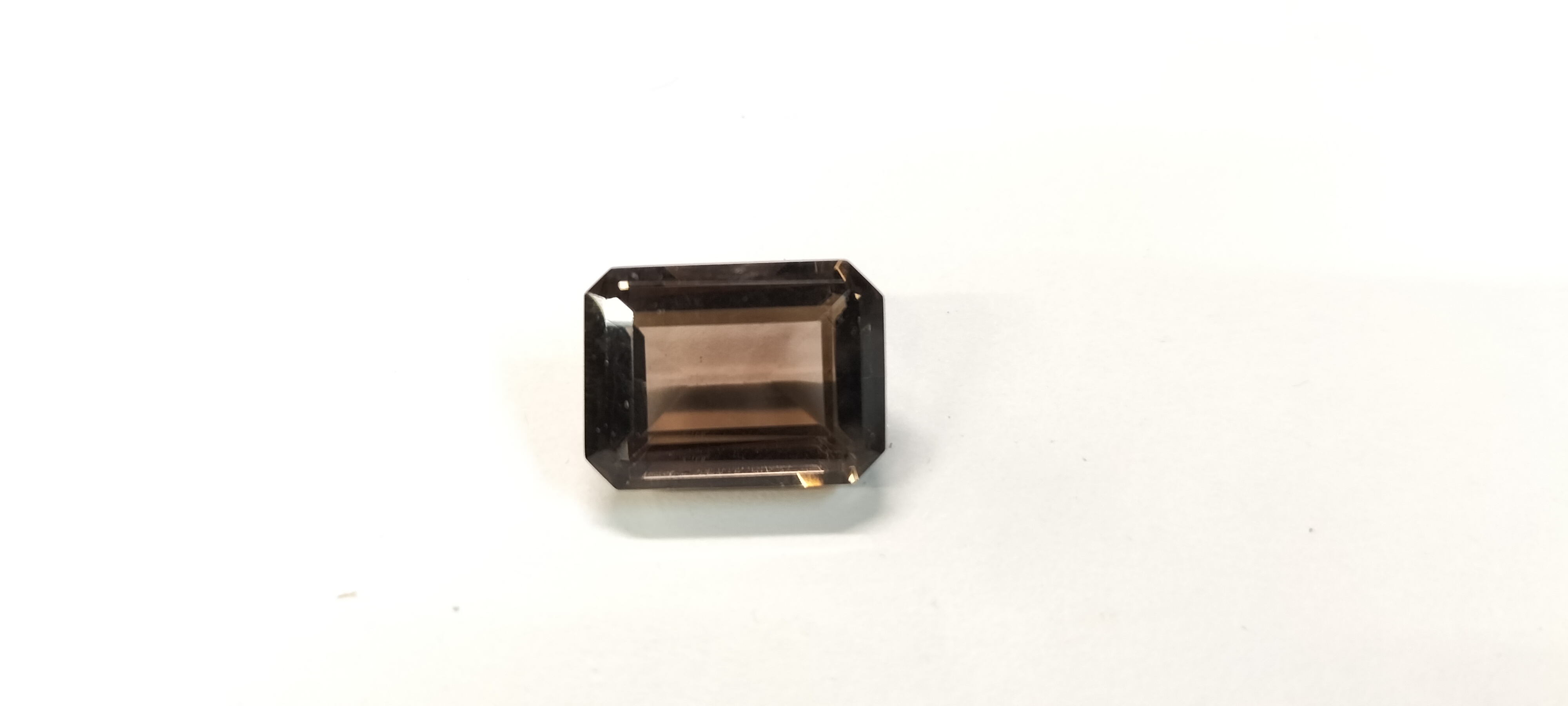 A Single 10.90 ct Emerald Cut Chocolate Topaz Gemstone