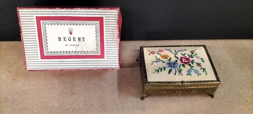 Lot 376: A Regent of London Brass Toned and Petit Point Musical Jewellery Box