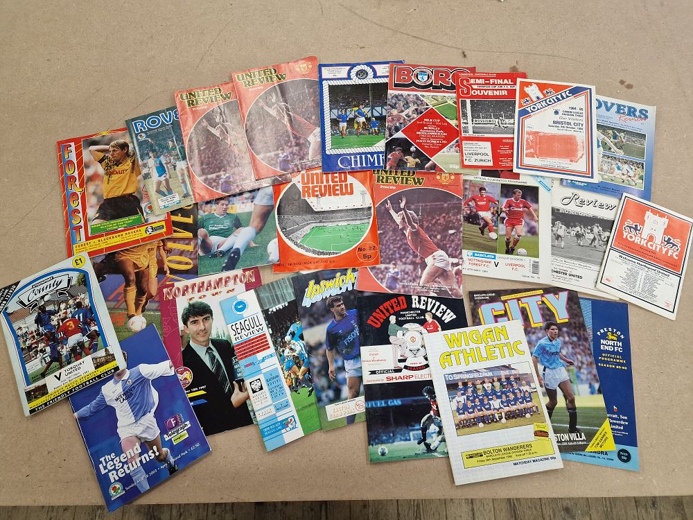 Lot 476: An Assortment of 20 Paper Football Matchday Programmes Including Manchester United Review and Liverpool F.C. Souvenir