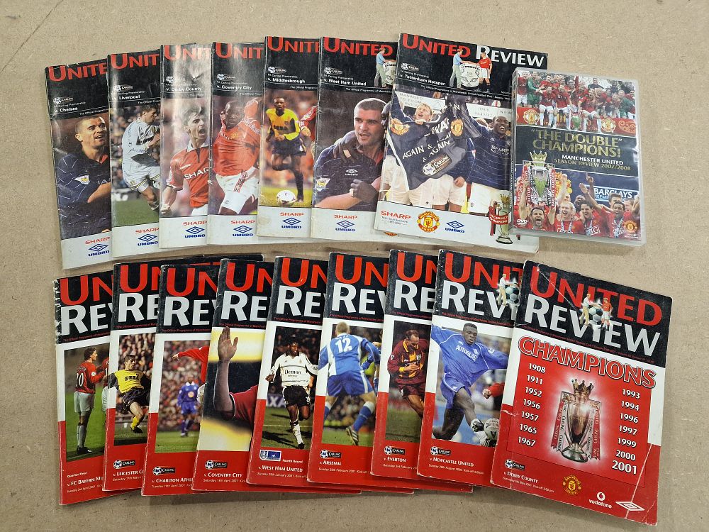 Lot 499: 16x Manchester United FC United Review Matchday Programmes and 1x Season Review DVD