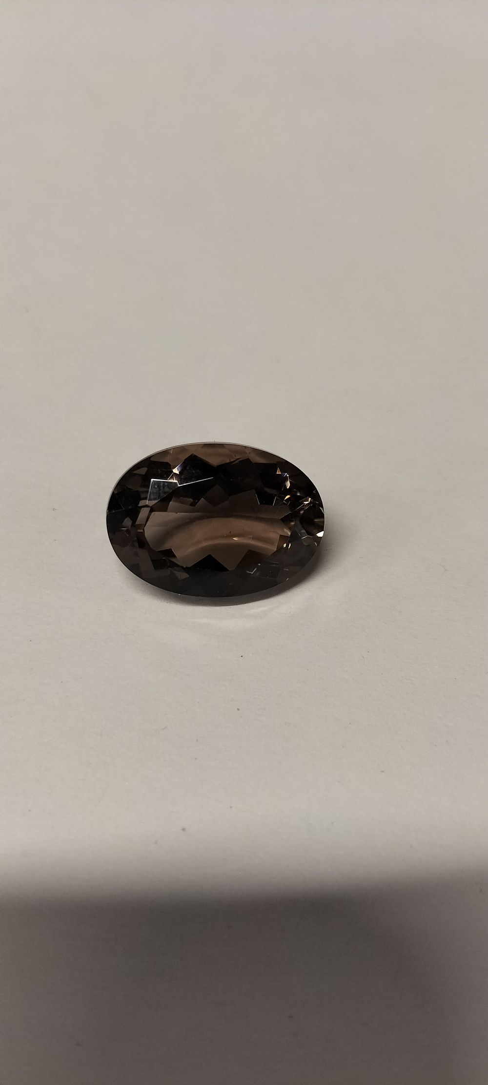 Lot 331: A Single Loose Oval Faceted Smoky Quartz Gemstone