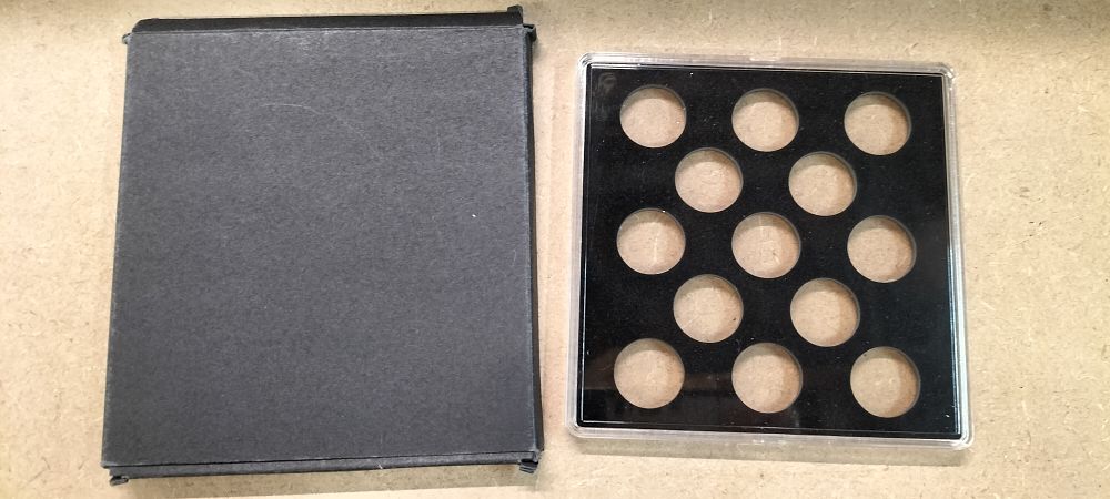 Lot 375: A Plastic Coin Storage Case and Cardboard Sleeve