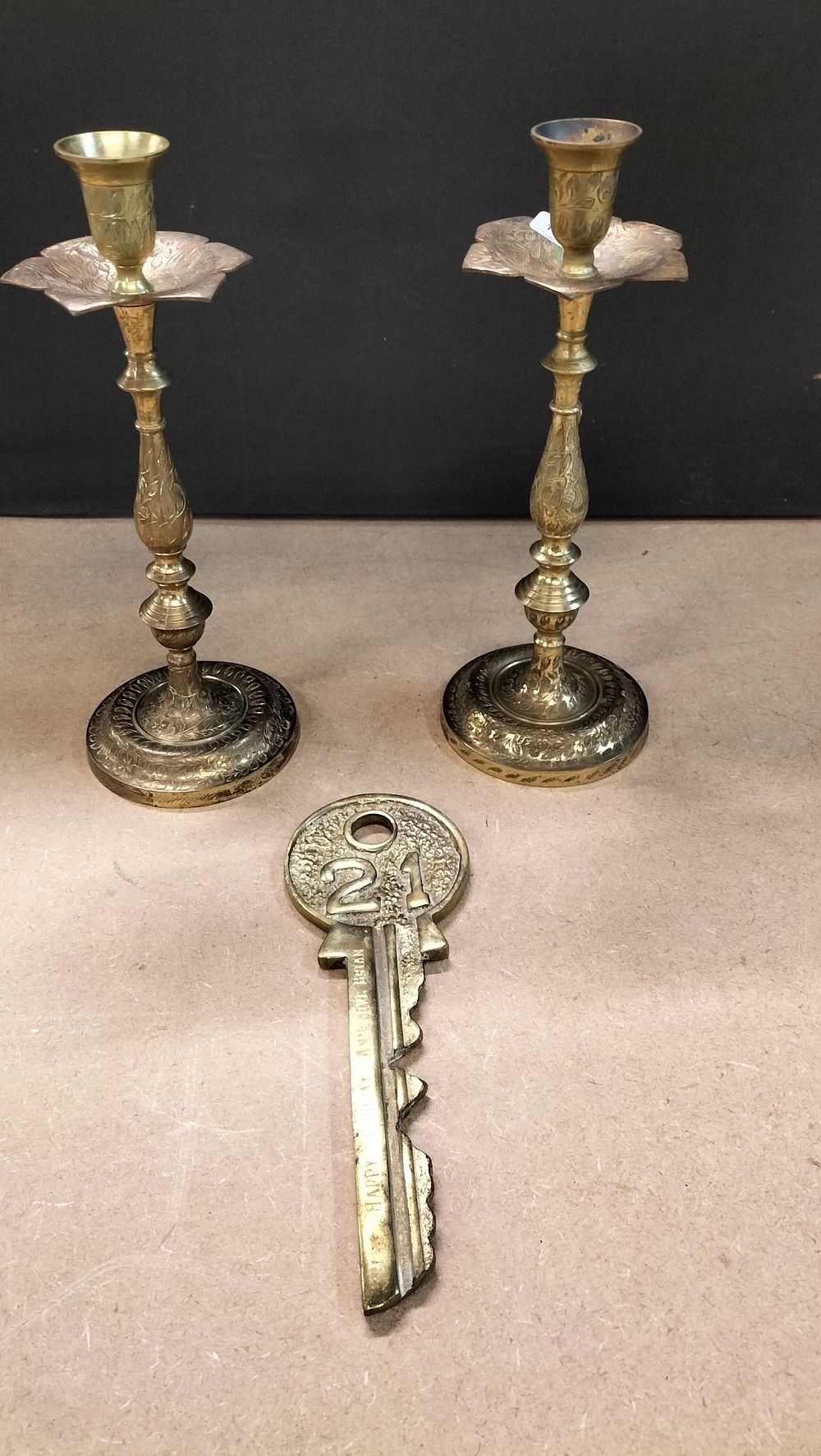Lot 262: 2x Engraved Brass Candlesticks and a Commemorative Key