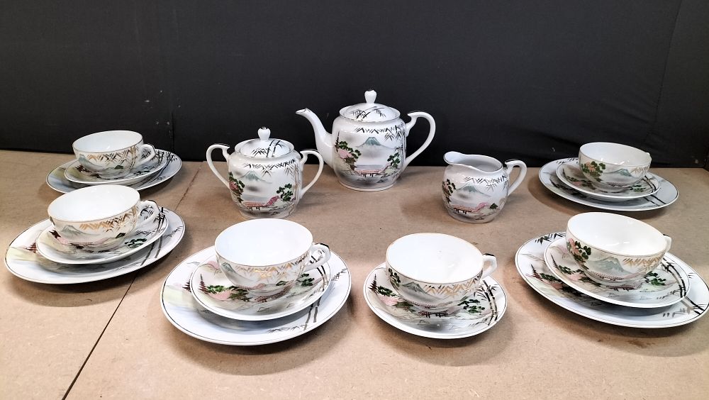 Lot 267: A 60 Year Old 21 Piece Eggshell Porcelain Tea Service with Mount Fuji Decoration