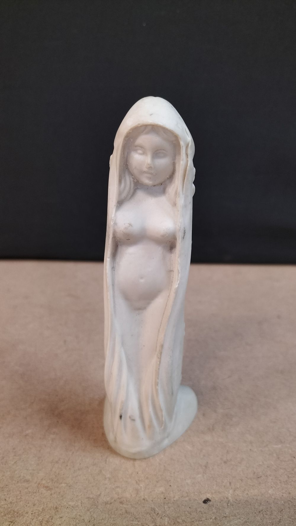 Lot 272: A Dual-Sided Off-White Composite Fertility Figurine