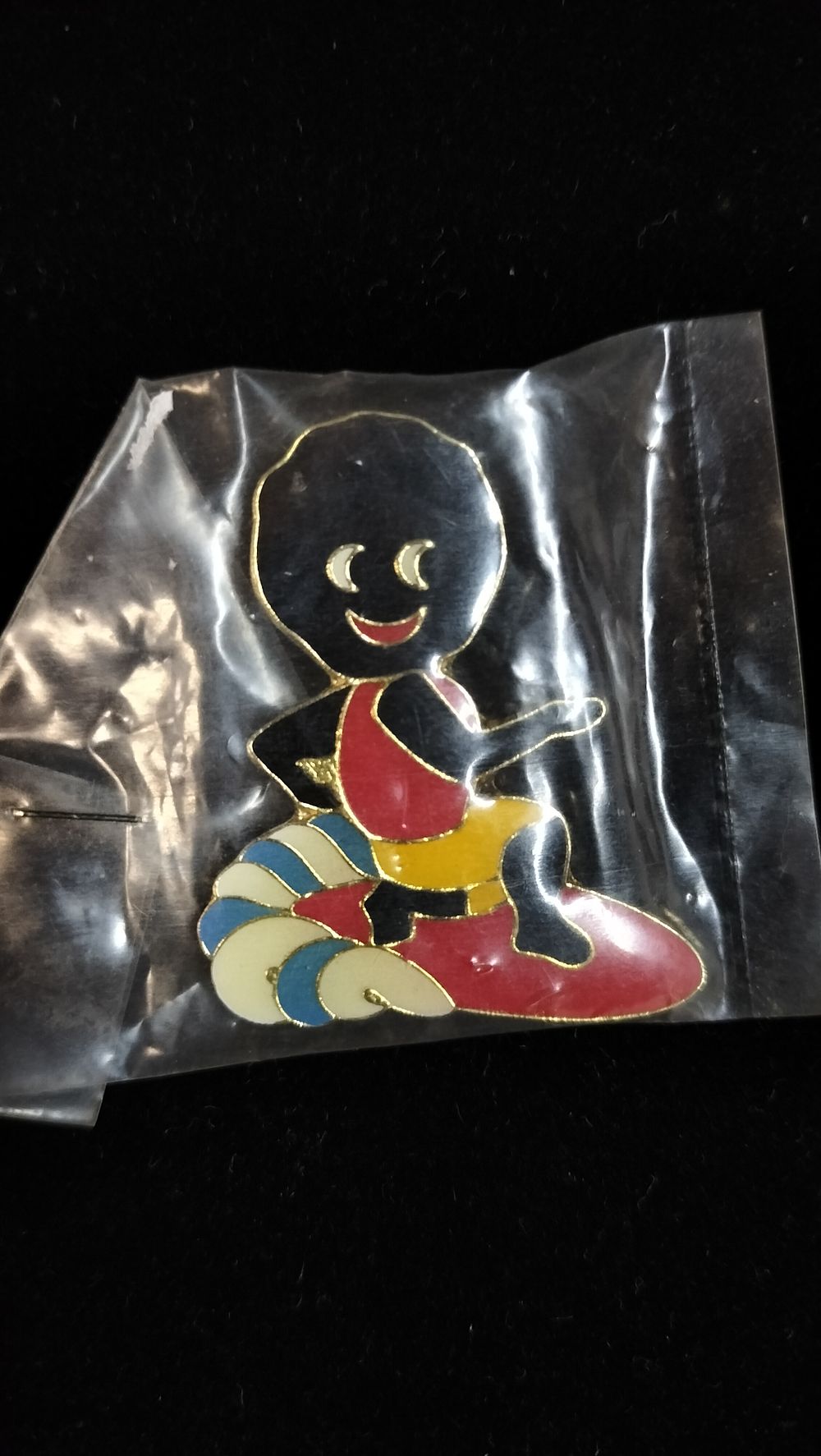 Lot 277: A Robertson's Golly Surfer Gilt Metal Enamel Pin Badge