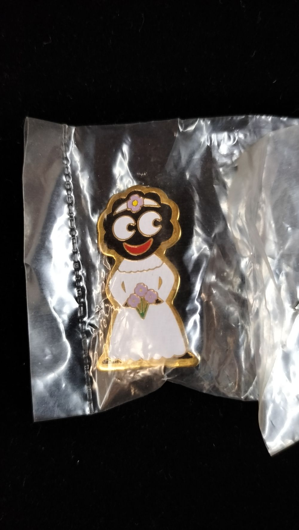 Lot 279: A J. Robertson's Enamel Bride Mascot Lapel Badge