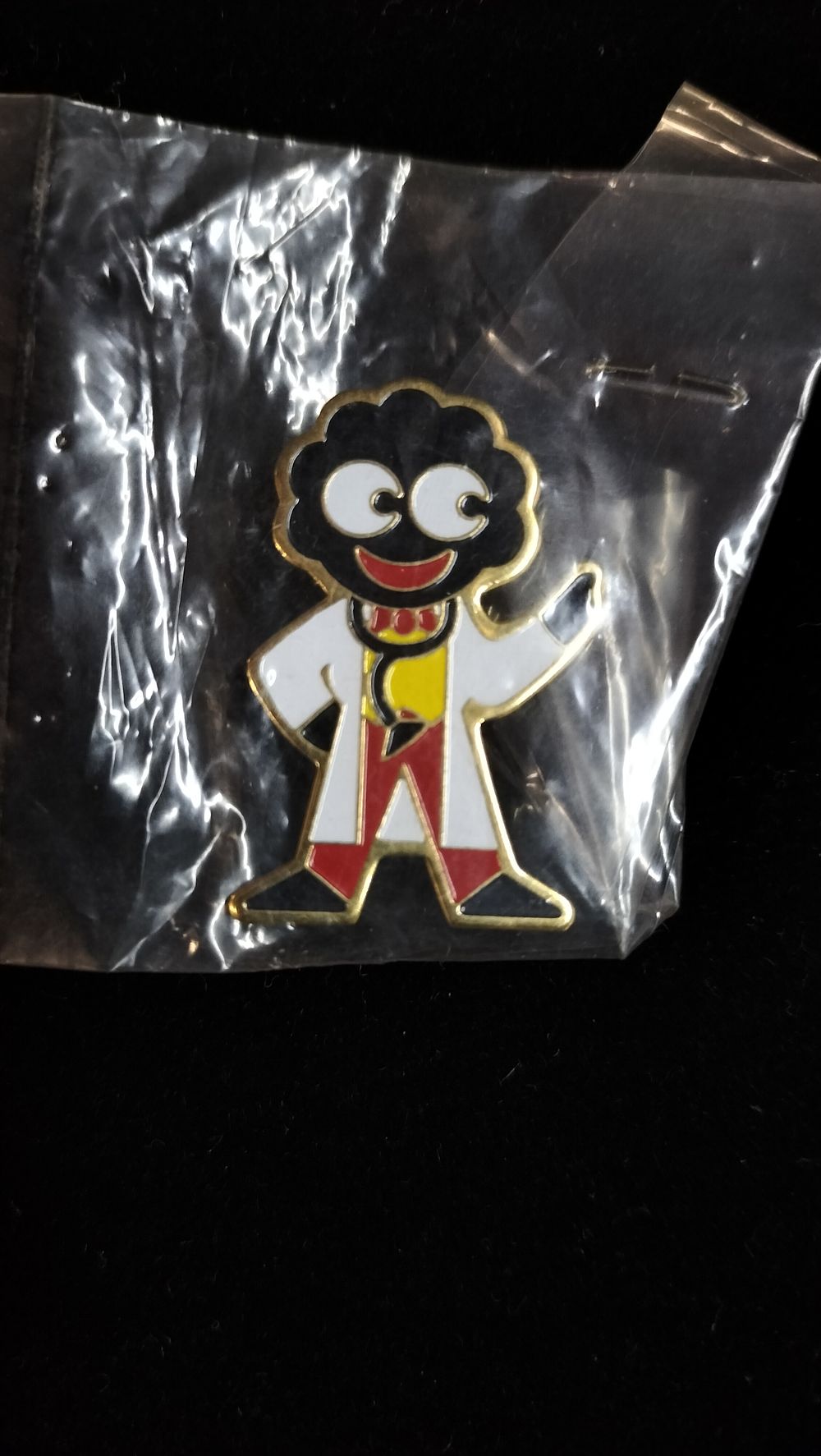 Lot 282: A Robertson's Doctor Mascot Enamel and Gold-Tone Metal Pin Badge