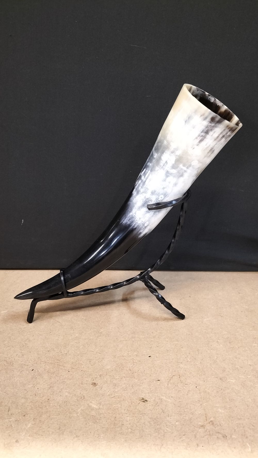 Lot 285: A Polished Natural Horn with Wrought Iron Stand