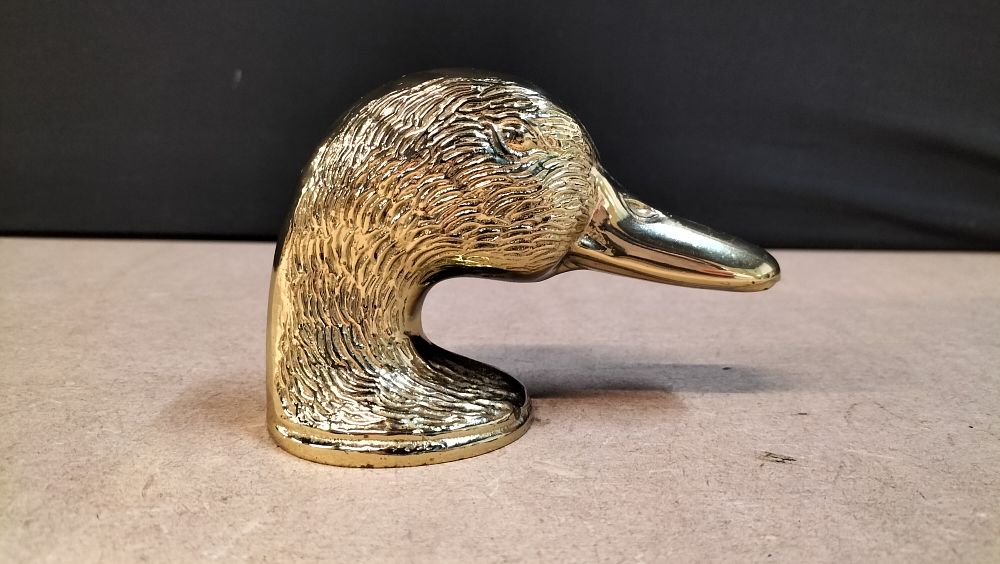 Lot 293: A Brass Duck Head Figural Bottle Opener