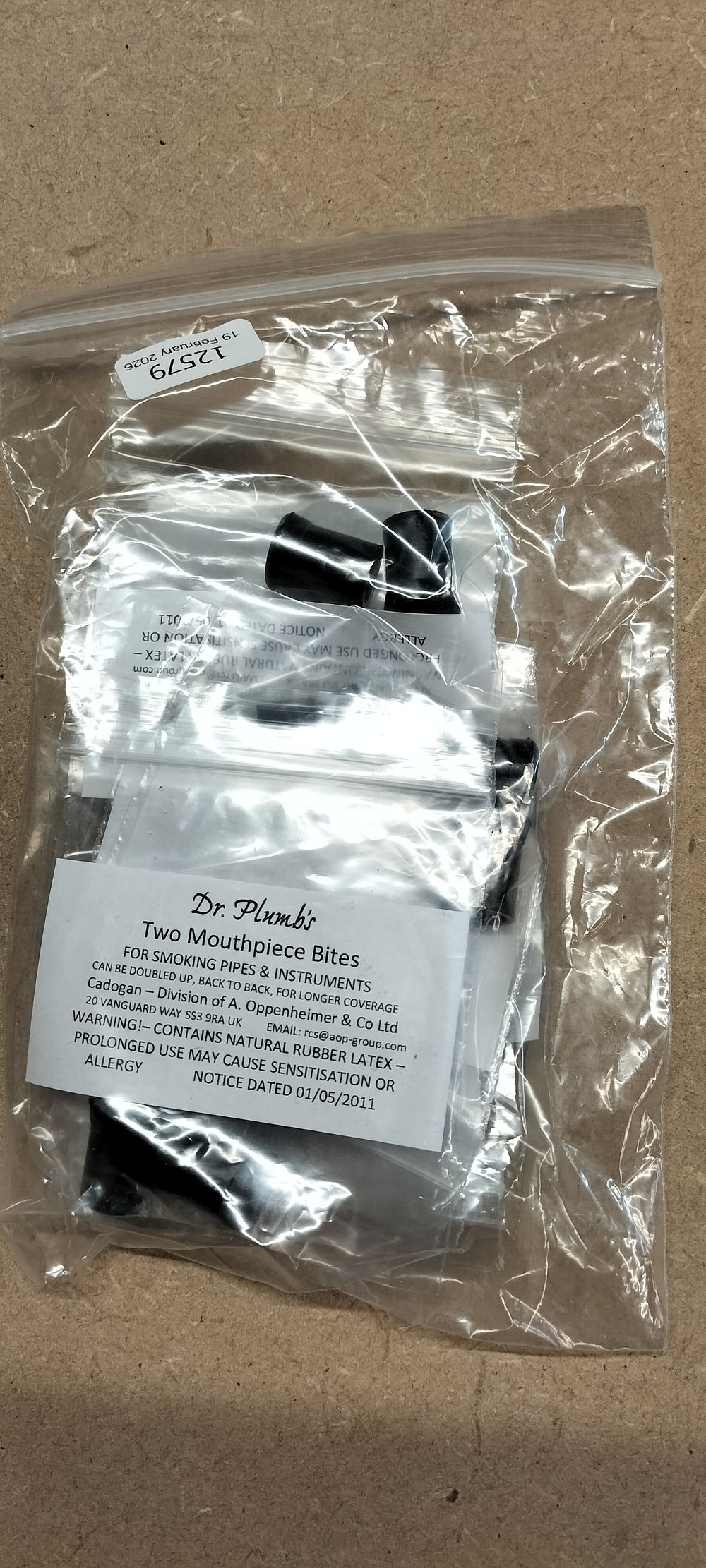 Lot 303: A Collection of 8 Dr. Plumb's Rubber Mouthpiece Bites Retail Packs