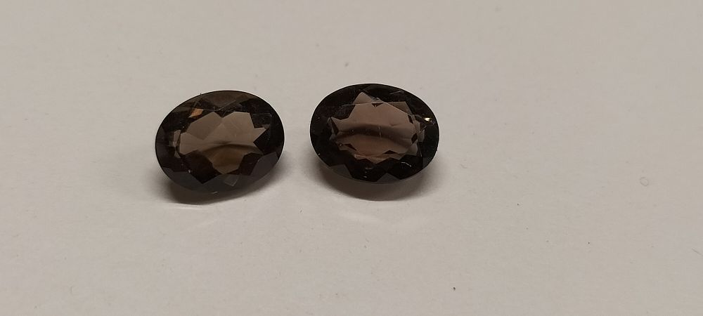 Lot 313: A Pair of Oval Mixed-Cut Chocolate Topaz Gemstones 3.70 ct