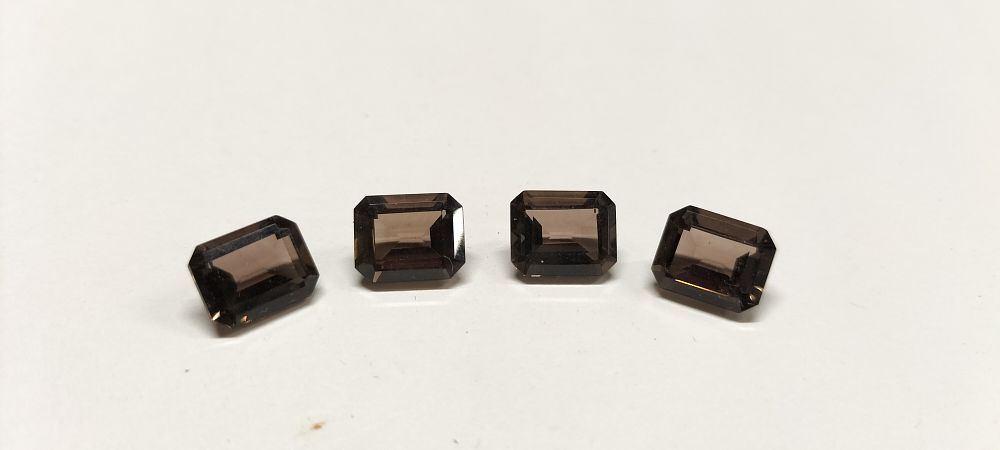 Lot 314: A Set of 4 Emerald Cut Chocolate Topaz Gemstones 11.85 ct