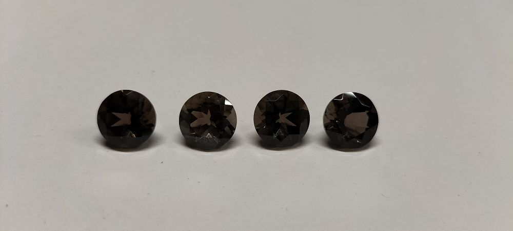 Lot 315: 4 Faceted Chocolate Topaz Gemstones 14.65 ct