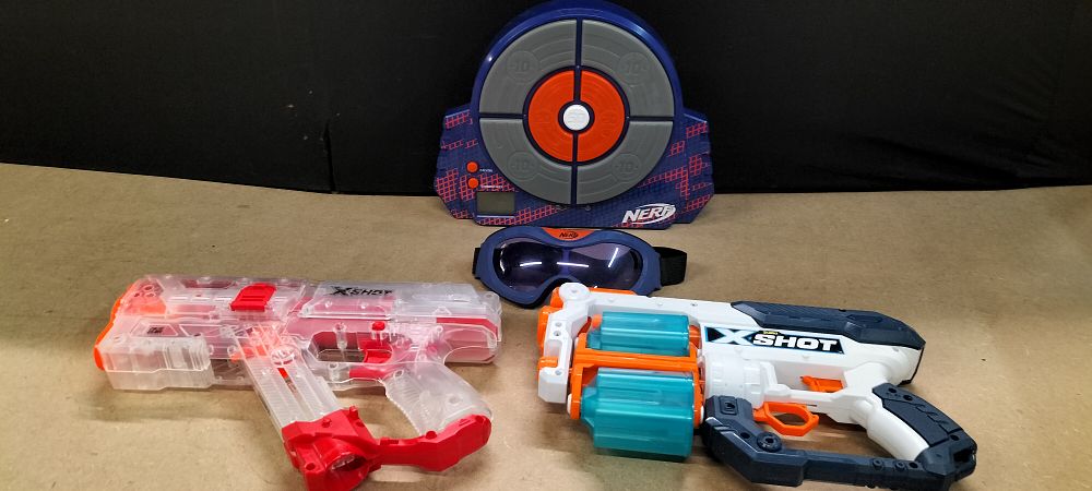 Lot 336: A Collection of 4 Plastic NERF and X-SHOT Blasters and Accessories