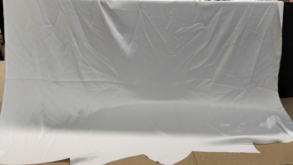 Lot 343: A Single Length of White Faux Satin Fabric