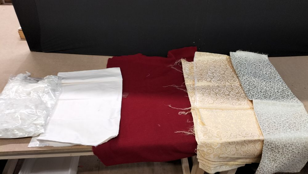 Lot 344: An Assortment of Kandola Silks and Decorative Fabric Remnants with Craft Feathers