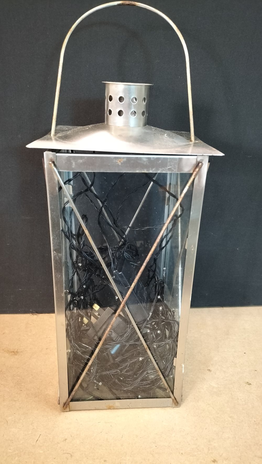 Lot 161: A Stainless Steel and Glass Decorative Lantern Containing LED Fairy Lights