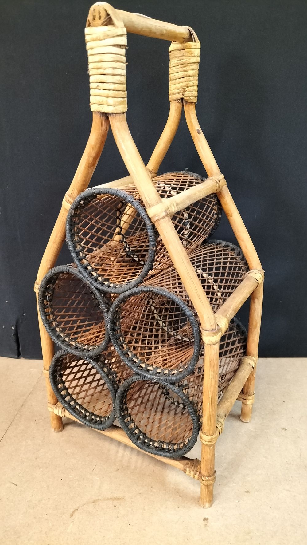 Lot 165: A Vintage Bamboo and Wicker Five Bottle Wine Carrier