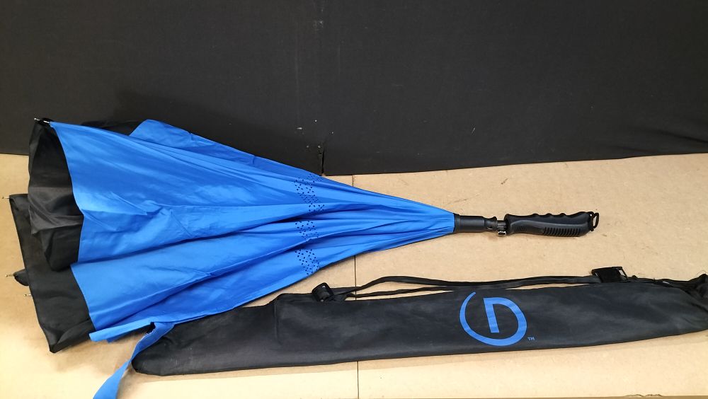 Lot 179: A Double Canopy Synthetic Fabric Golf Umbrella With Storage Sleeve