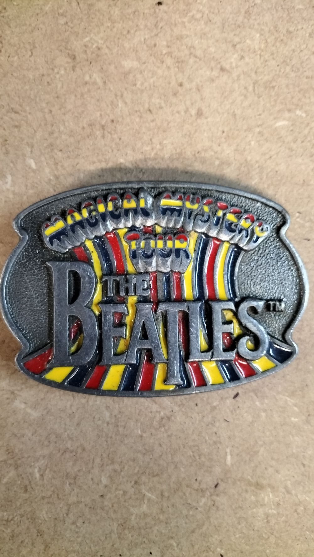 Lot 193: A The Beatles Magical Mystery Tour Enamelled Composite Belt Buckle