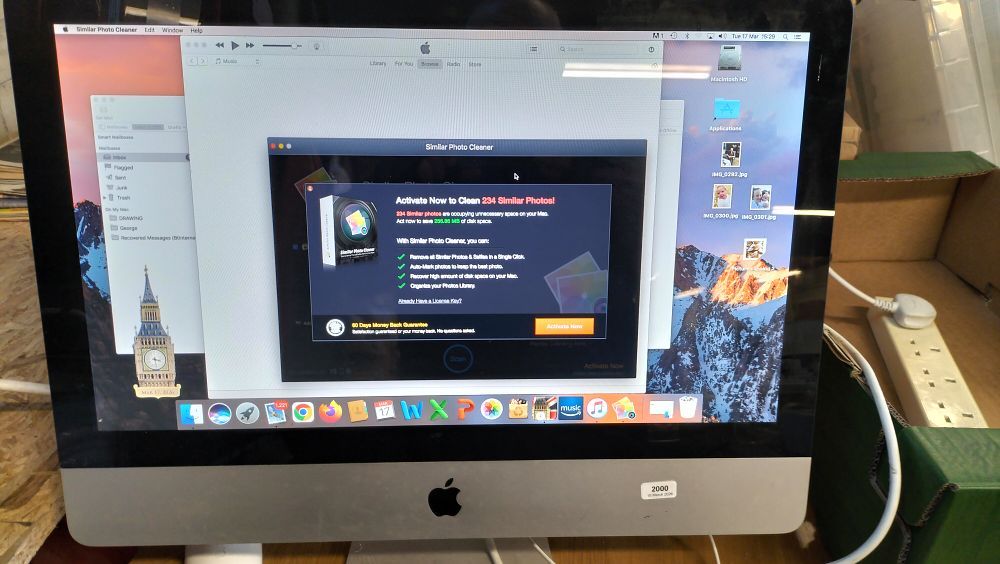 Lot 203: An Apple All-in-One Desktop Computer and Magic Mouse A1296