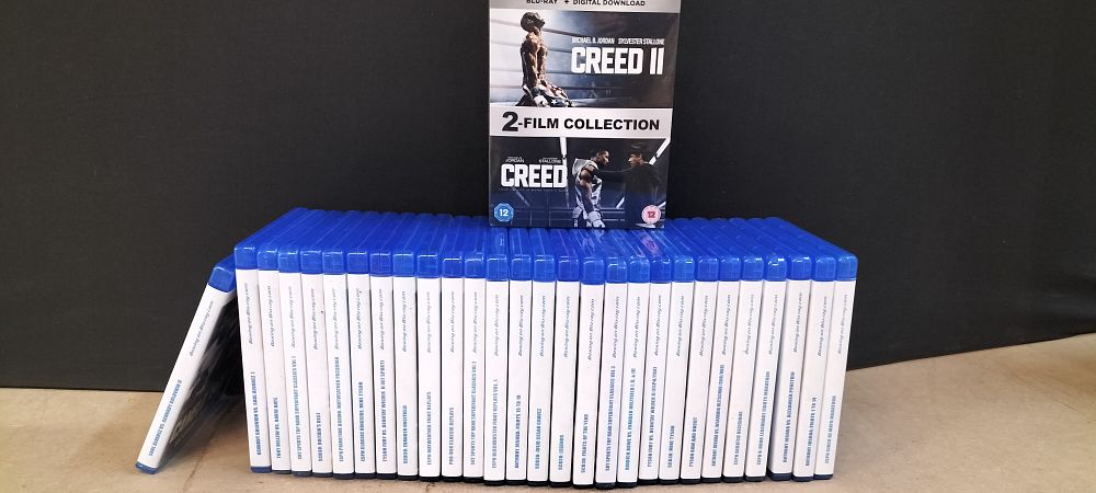 Lot 234: A Collection of Boxing Fight Blu-ray Discs and Creed 2-Film Collection