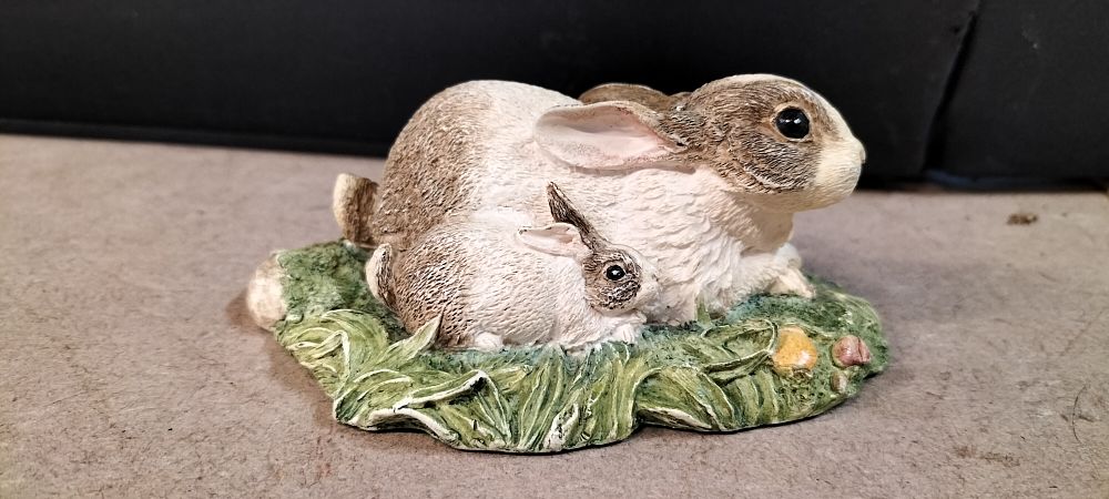 Lot 323: A John Beswick Hand Decorated Resin Rabbit Group, Contentment