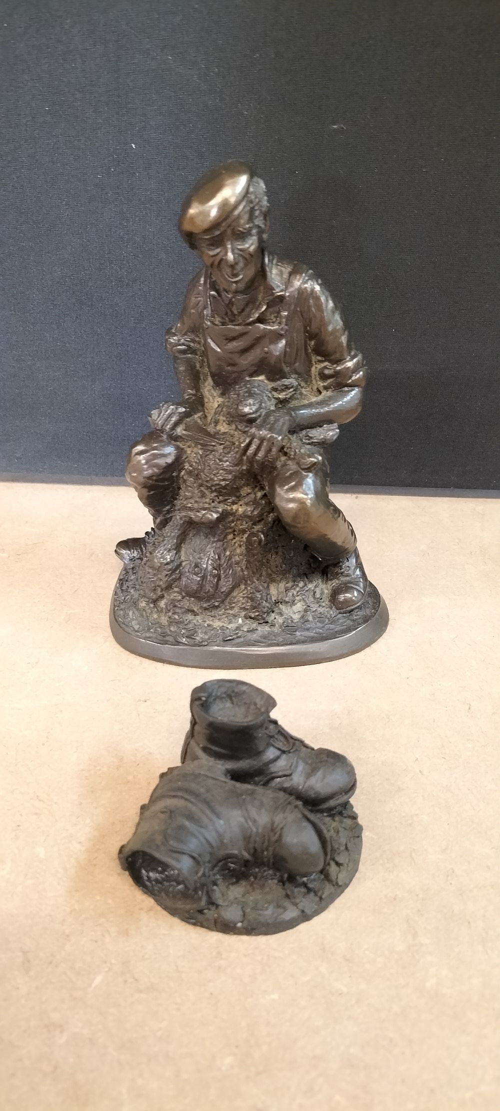 Lot 324: 2 North East England Coal Resin Figurines Depicting a Sheep Shearer and Work Boots