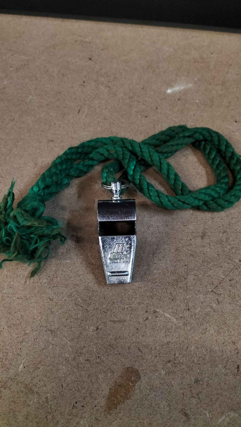 Lot 380: A Vintage Mitre Chrome Plated Metal Football Whistle with Lanyard