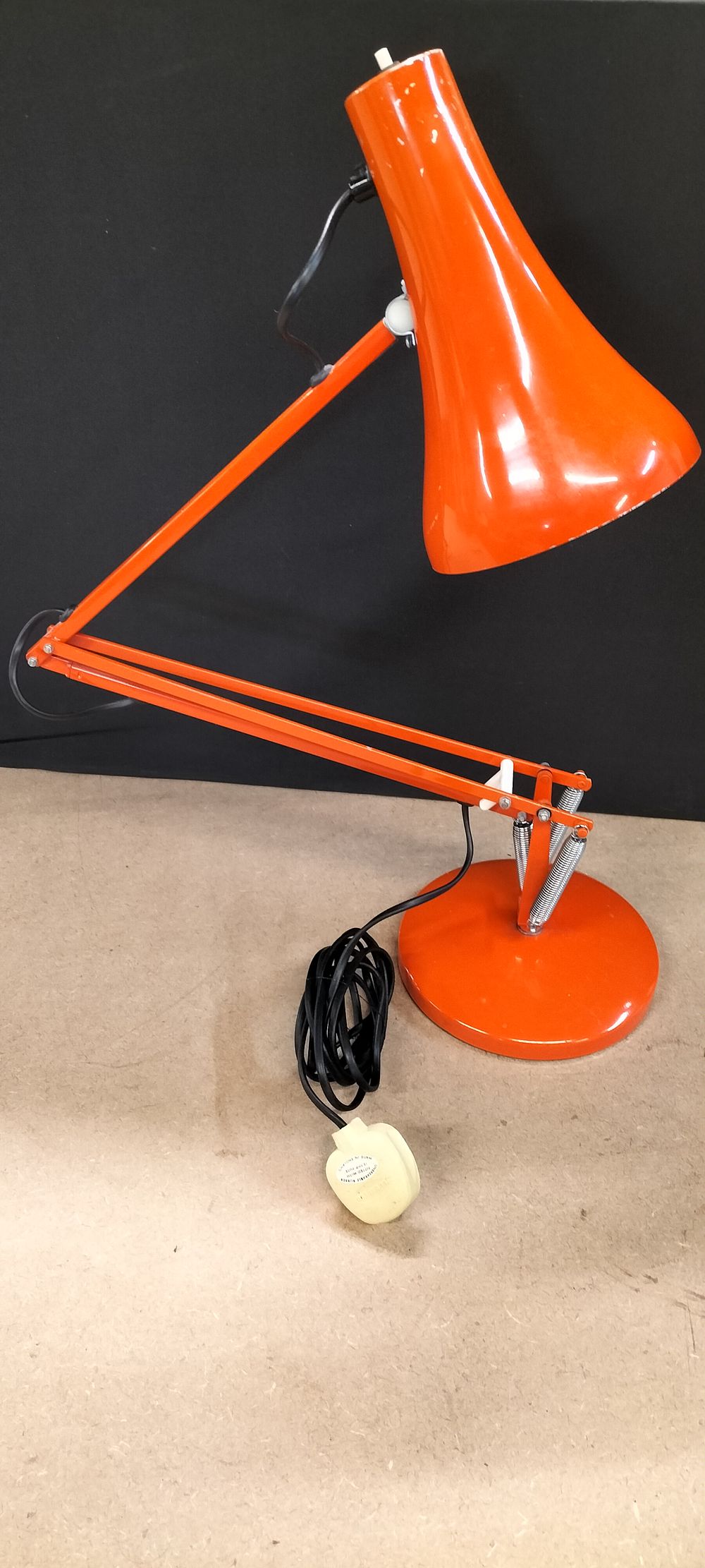 Lot 157: An Orange Articulated Metal Desk Lamp