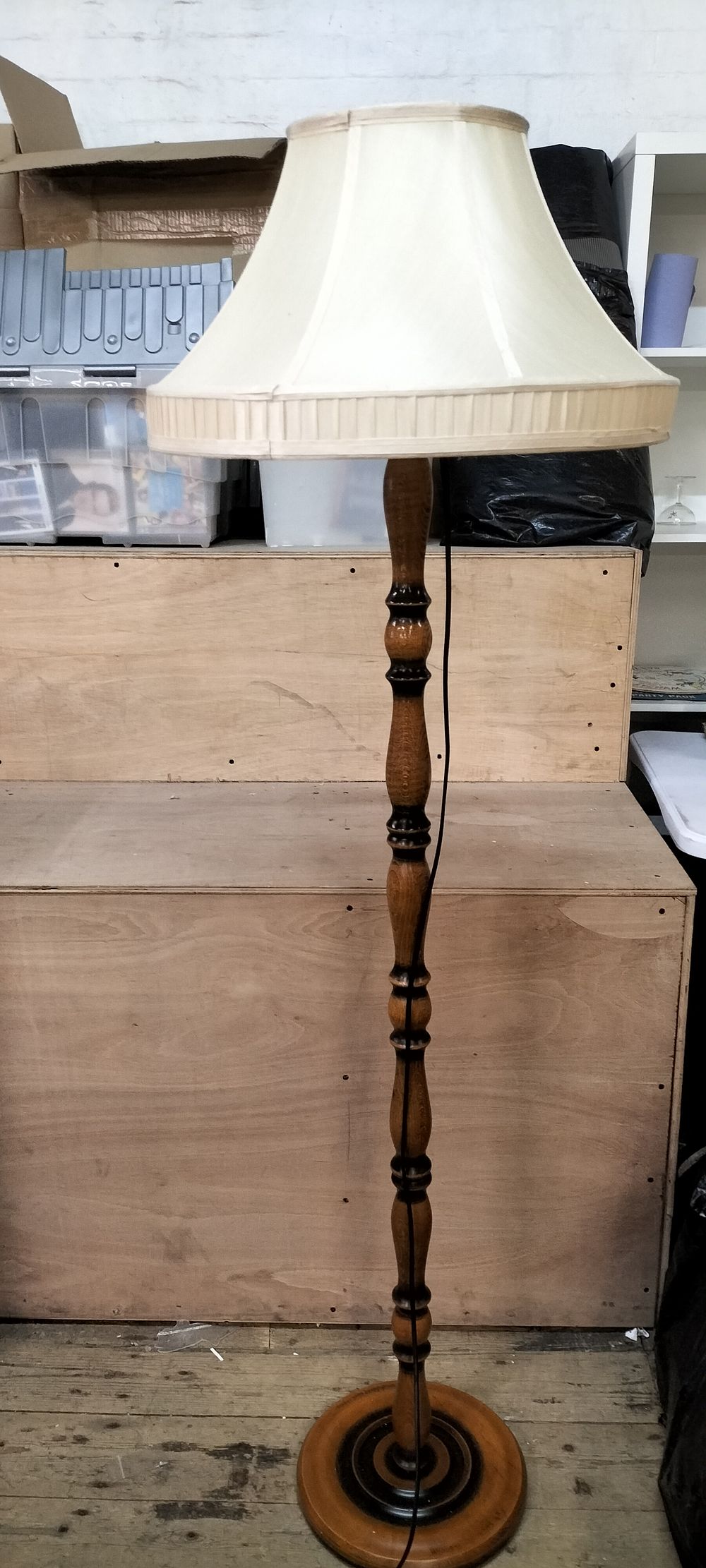 Lot 168: A Turned Wood Standing Floor Lamp with Fabric Shade