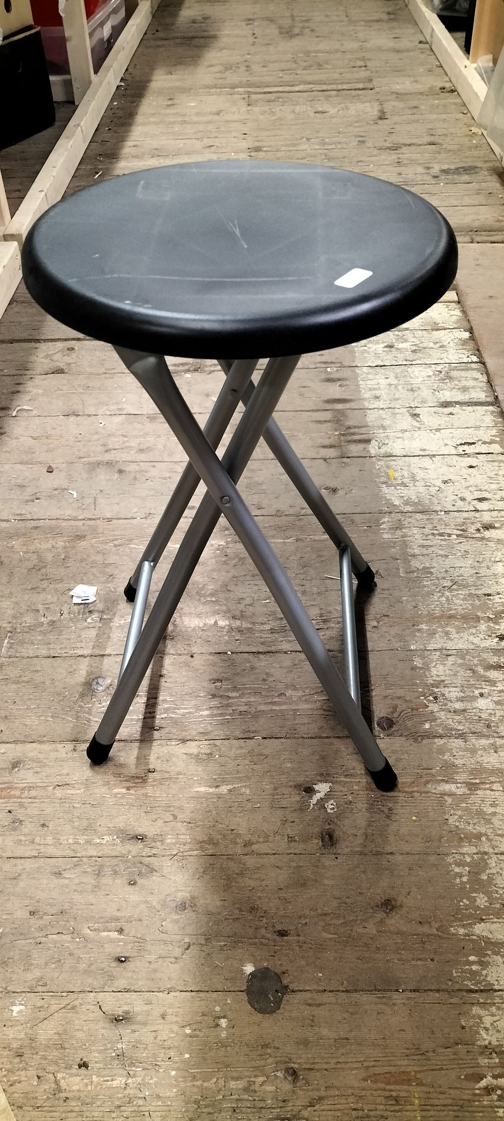 Lot 232: A Folding Stool with Black Plastic Seat and Silver Toned Metal Frame