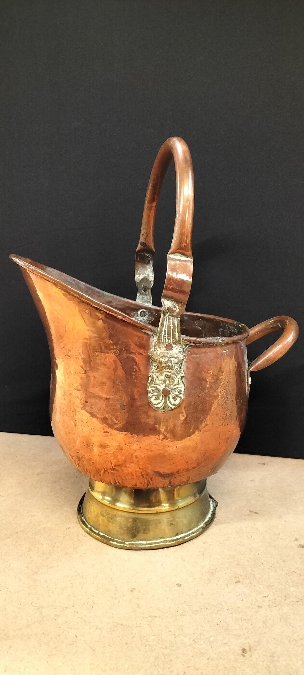 Lot 254: A Victorian Style Hammered Copper Helmet Coal Scuttle with Brass Pedestal Base