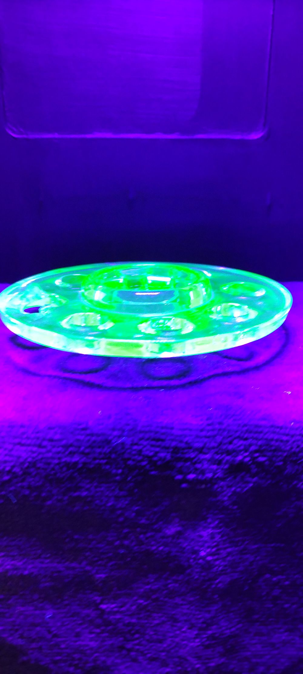 Lot 277: A Pressed Uranium Glass Circular Flower Frog